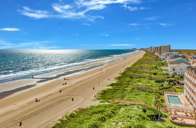 Waves of Fun - steps to beach, pool, spa, game room, bar, bikes, ocean views