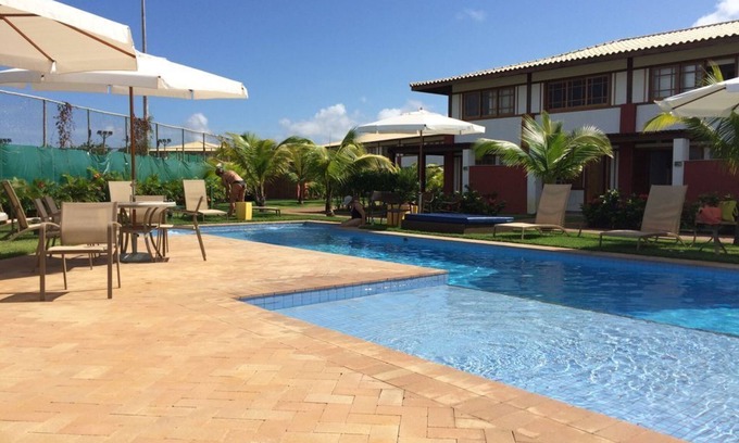 Praia do Forte Apartment | 110 m2 apartment with 2 suites overlooking environmental protection area