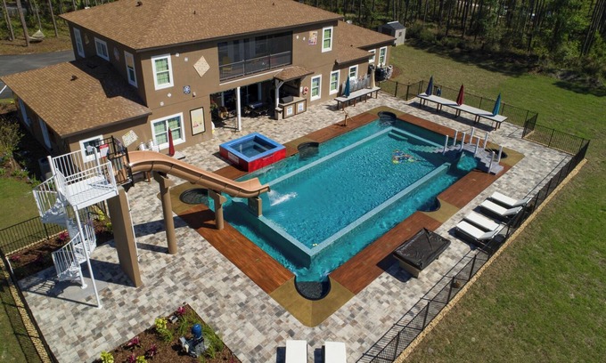 Groveland Villa | 15 Bedroom Game-Filled Fun House on 10 Acres Near Orlando!