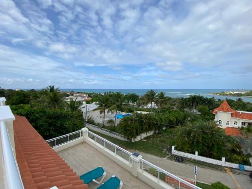Cofresi Villa | 2 BR & 1WR Suite at Villa Costa Verde near Playa Cofresi, Puerto Plata with a pool, balcony, and a rooftop terrace