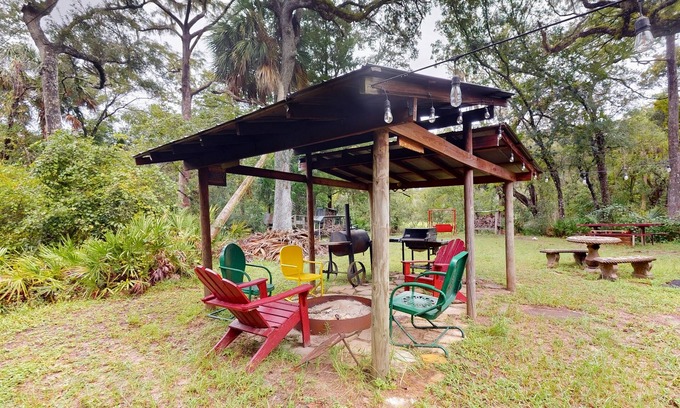 Bronson Cabin | 2 riverfront cabins with large yard, grill, firepit, canoe, & private W/D