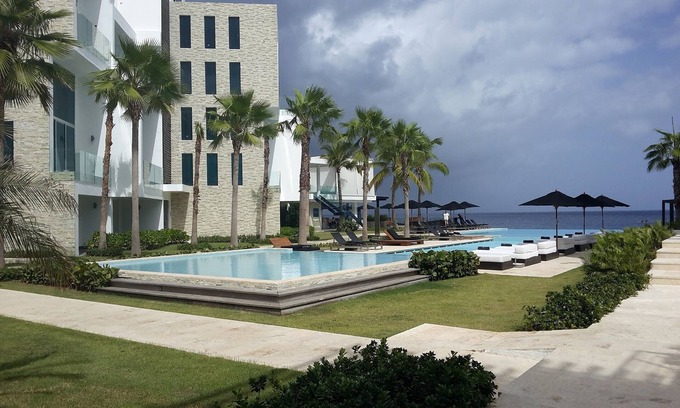 El Batey Apartment | 3BD luxury beachfront condo with gym, elevator, infinity pool. Reduced rate!