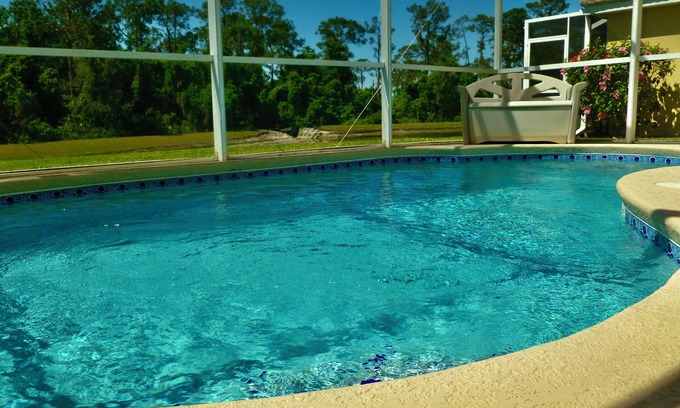 Haines City House | 4 bed/3 bath house with private pool overlooking a lake and nature preserve.