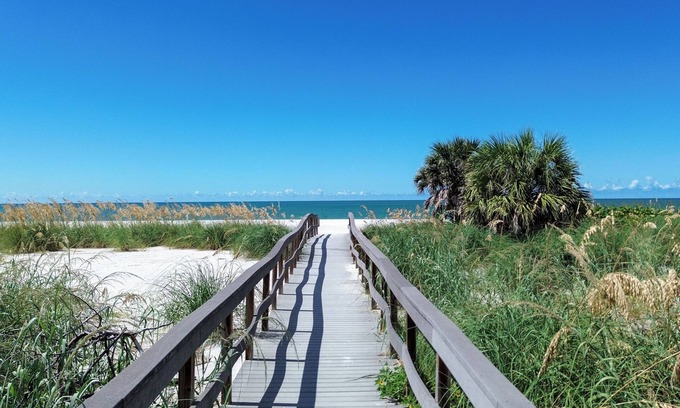 Treasure Island Apartment | 🌞400 ft to the Beach👙Onsite Heated Pool🐬Bungalows #2🌴Grills🐶Dogs Welcome!