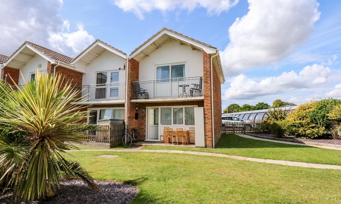 Corton Cottage | 63 THE WATERSIDE HOLIDAY PARK, pet friendly, with pool in Corton