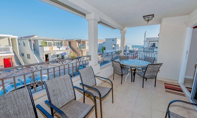 West Newport Condo | 7BR Retreat with Ocean View Balcony & Patio, Just Steps from the Sand!