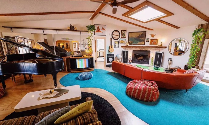 Yucca Valley House | 80s dreamworld with waterfall lagoon, bowling lane, hot tub under the Milky Way