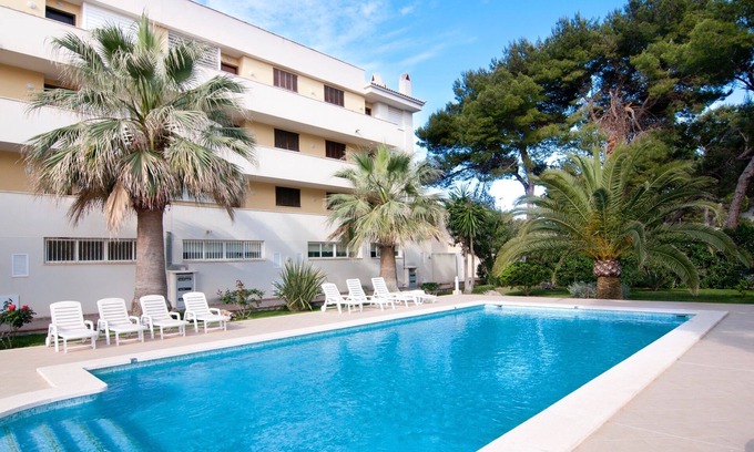 Cala Agulla Apartment | Apartment “Drac Blanc 1-3” with Sea View, Balcony, Garden & Air Conditioning