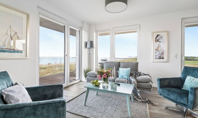 Olpenitz Apartment | "BeachWaveFour": Holiday apartment right on the beach with sauna, balcony & Baltic Sea view