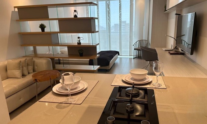 Riomar Apartment | Beautiful and modern loft with balcony, jacuzzi and privileged location District 90