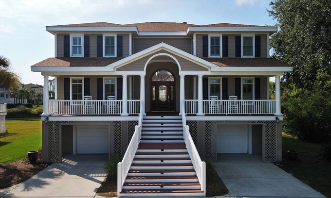 Ocean Point House | Beautiful home with open porches overlooking lagoon in Wild Dunes