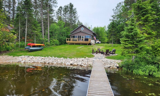 Gould City Cottage | Beautiful Lake House With Outdoor Firepit and Great Fishing!