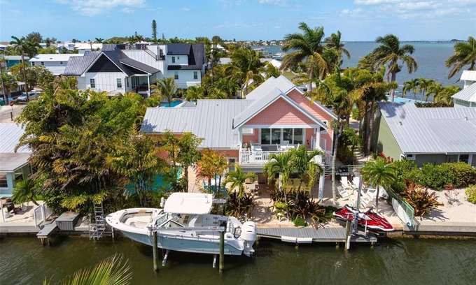 Bradenton Beach House | Beautiful waterfront home with pool and boat dock - steps to the beach!