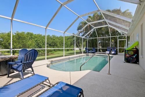 Sabal Harbour House | Blue Heron House! Cozy home with heated pool and pool toys! Water view out back!