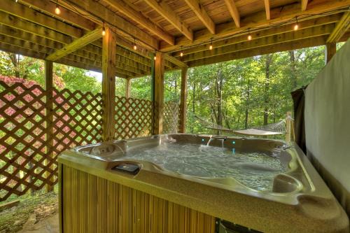 Natures Courtyard Villa | Buffalo Ridge Fish in the pond soak in the hot tub