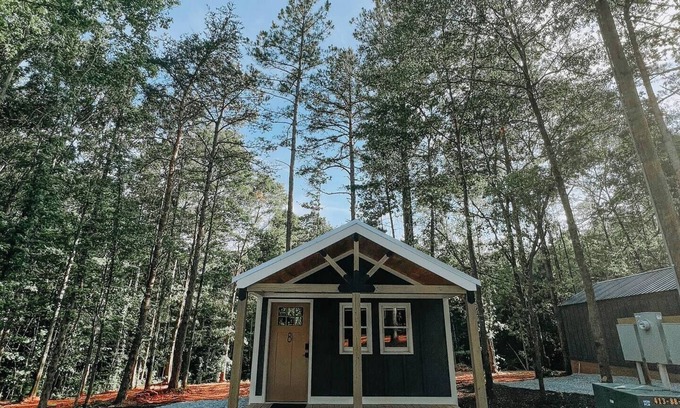 Hartwell RV Rental | Cabin #8: Studio style layout with kitchenette and a large gravel parking pad beside the cabin for easy boat or trailer storage.