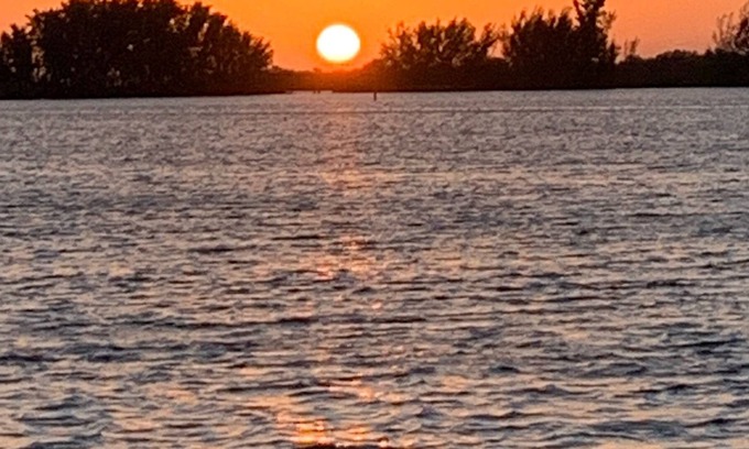 Hudson Beach Estates House | Canal front home minutes to Gulf of Mexico with back yard oasis.