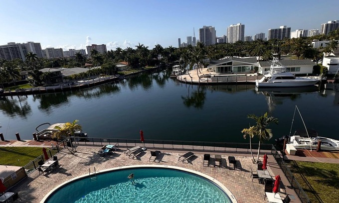Hallandale Beach Condo | Canal & Pool View Chic 1BR with Balcony – Short Stroll to Hallandale Beach