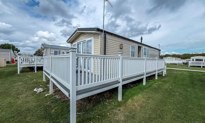 Colchester House | Caravan with large decking at Coopers Beach Holiday Park ref 49012SV