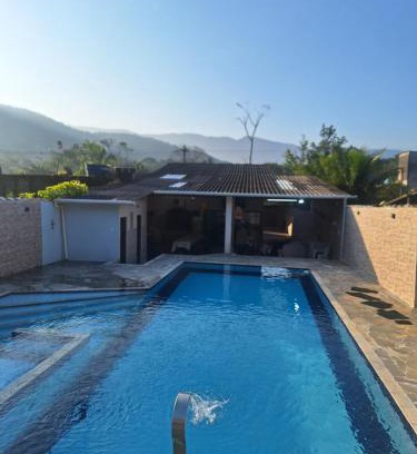 Caiubura House | Casa em Bertioga com piscina aquecida