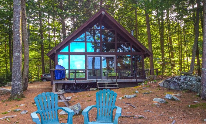 Meredith Cottage | Chalet-style lakefront home with private dock, beach, kayak, canoe & epic view