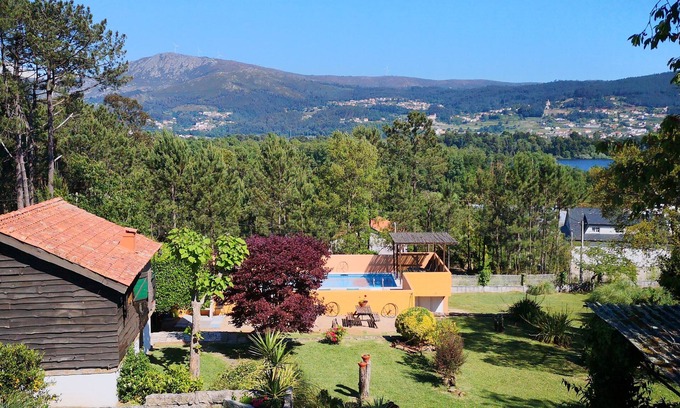 O Rosal Ski Chalet | Charming Rustic Lodge with Pool and Lovely views. Walk to Tapas Bar and Beach.