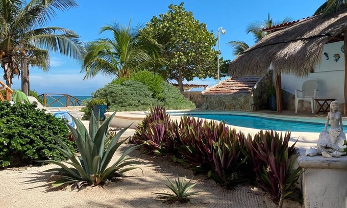 Progreso Municipality House | Charming single level beachfront home! Garden oasis & private waterfall pool.