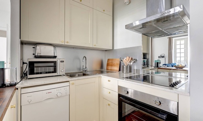 8th Arrondissement Apartment | Chic 2BR with Balcony near Arc de Triomphe
