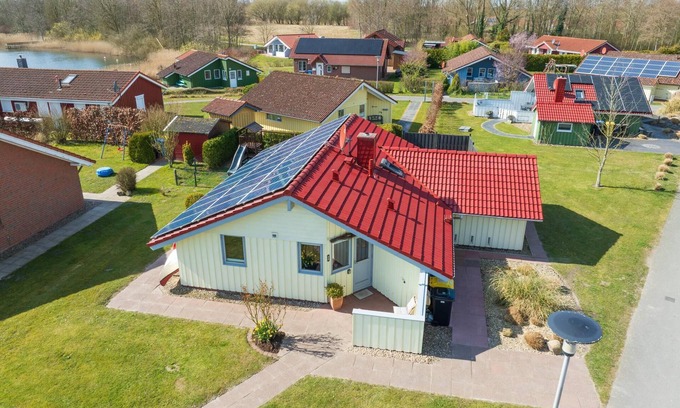 Norderteil House | Child-friendly 5-person wellness holiday home Treibholz with two showers and toilets, sauna, whirlpool, wood-burning stove, conservatory and canoe in Otterndorf