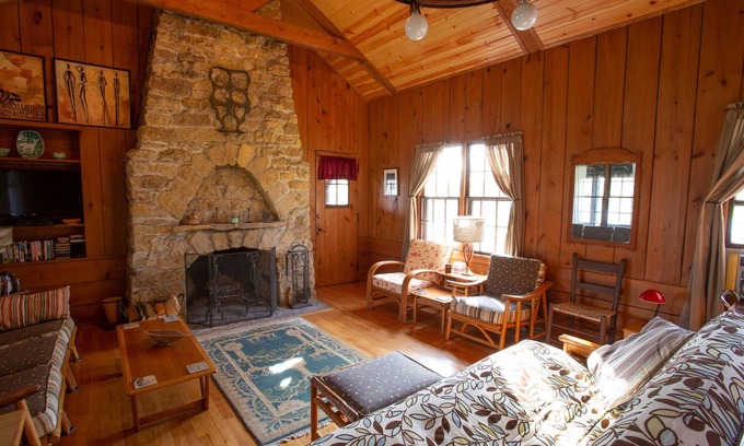 Lake Ripley Cottage | Classic cabin/cottage with big screen porch, stone fireplace, knotty pine walls.