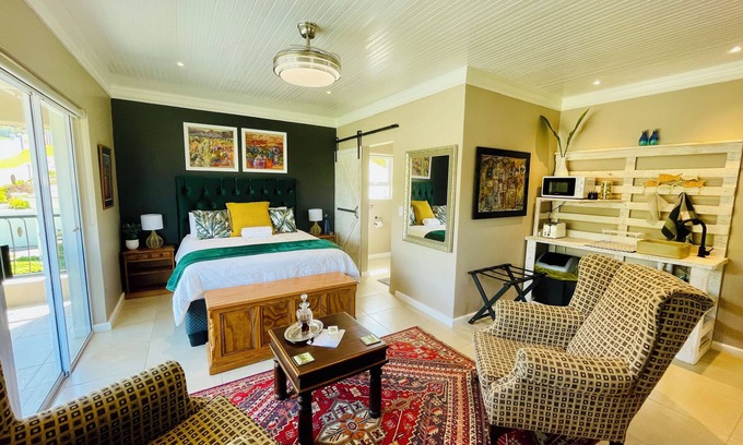 Plettenberg Bay Apartment | Coastal Studio Suite in Plettenberg Bay: Private Terrace, Art & Views