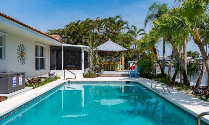Cocoa Isles House | Cocoa Beach Waterfront Home with Tiki Bar and Pool