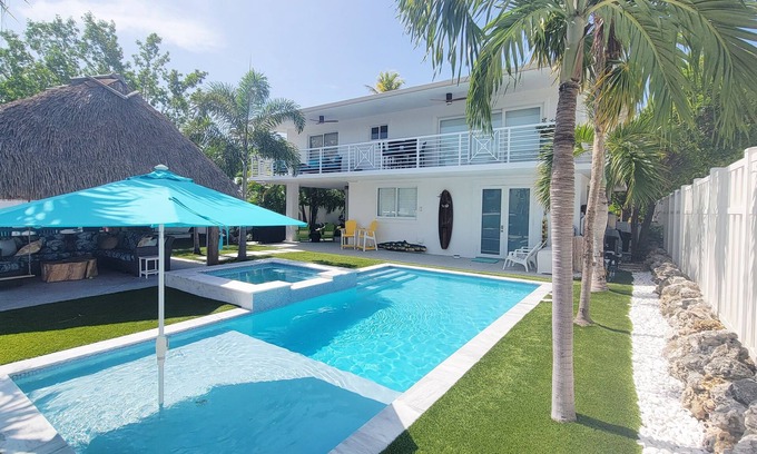 Tavernier House | Coconut Hut Oasis - 3 Bedroom Waterfront home with Pool/Spa, Tiki Hut, and Dock