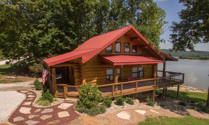 Magnet Cabin | Come sit, relax and unwind on the covered wraparound deck along the River.