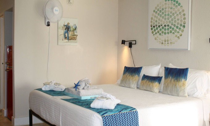 Whitfield Apartment | Couples Fall Refresher with Waterfront views in Executive suite, book now.