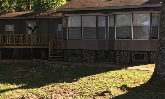 Houston House | Cozy on the lake lodging with kayaking and fishing supplies furnished.