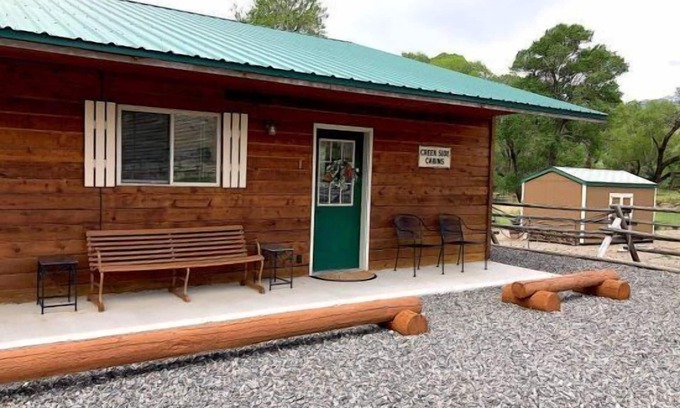 Cody Apartment | Creek Side Cabin #1 in the Wapiti Valley and steps from Trout Creek