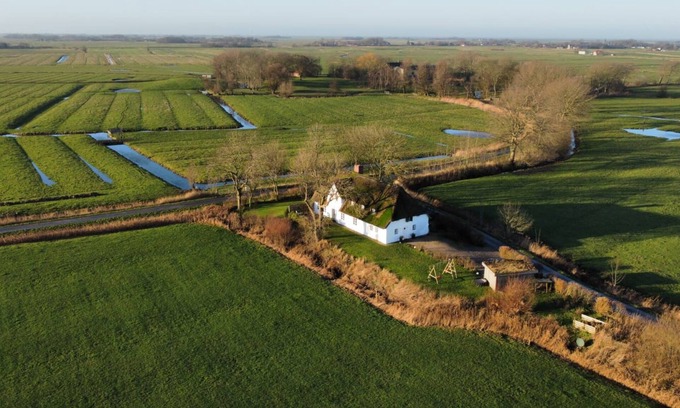 Poppenbull House | Dream house under thatch with fireplace, sauna, wellness room and lots of space