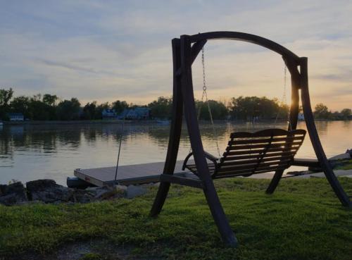 Quad Cities House | Eclectic Riverside Home 3 Season Room Large Deck