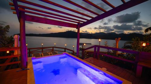 Punta Caribe Apartment | El Palacio Rosa on Blue Lagoon 2BR Beachfront Suite on pristine & quiet bay w incredible views