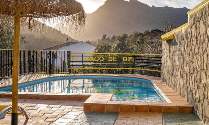 Alfarnate House | Enjoy a magnificent mountain panorama in this spacious vacation home with pool.