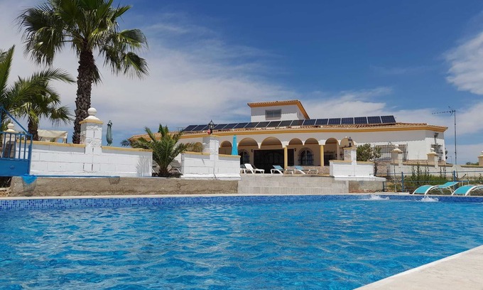 Lora Del Rio Ski Chalet | Exclusive CHALET near SEVILLA Andalusia with pool for 14 people