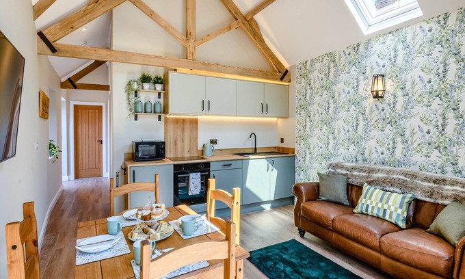 Arnold Cottage | Exposed beams and calming green colours for this holiday home.