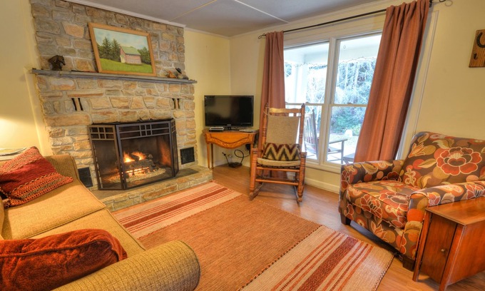 Almond Cabin | Front porch with bed swing, Pets Welcome, Hot Tub, Fireplace, Creek, Firepit.