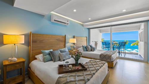 Las Glorias Apartment | Gorgeous 1BR Condo with Pools & Sea Views