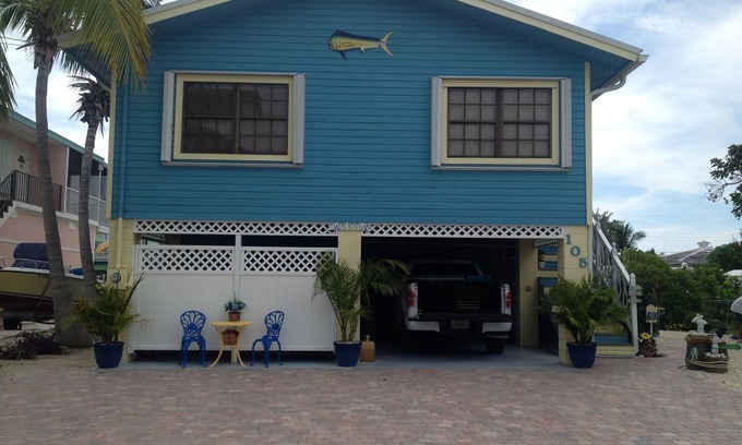 Long Key House | Happy "Key-z " canal-front home w/Tiki hut- RV storage available.