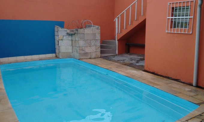 Mongagua House | Home with pool and games room, airy and comfortable, close to the beach.