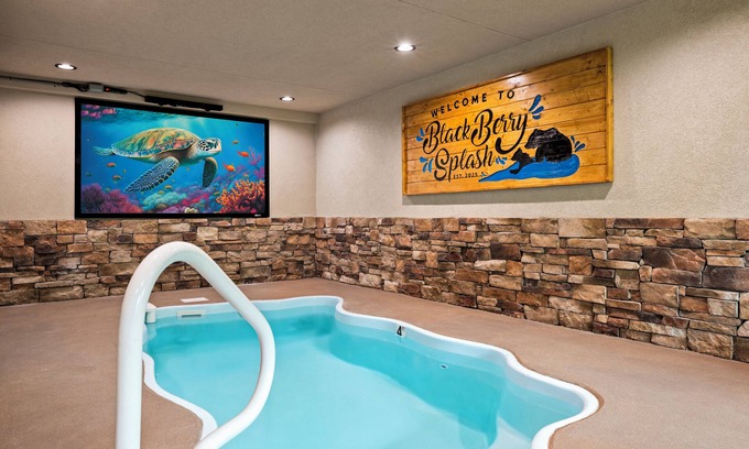 Pigeon Forge Cabin | Indoor Pool-Theater-Bunk Beds with Slide-Game Room-Hot Tub-5 min to Attractions!
