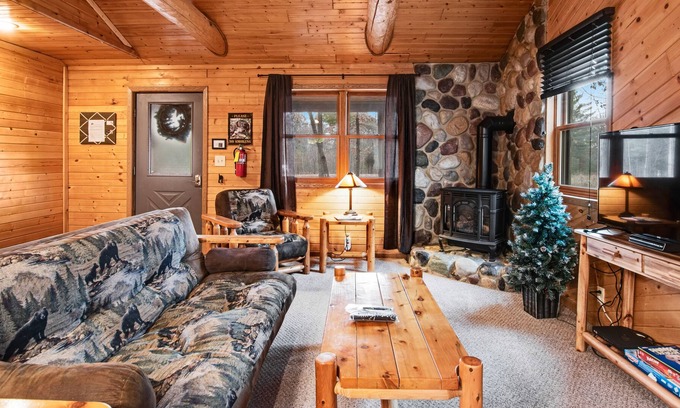 New Lisbon Cabin | Inviting dog-friendly cabin with hammock, fireplace, shared fishing pond, & A/C