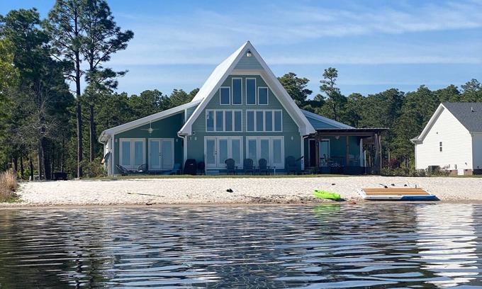 Council House | Lake front living with private sandy beach!